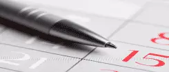 image of a pen on a calendar