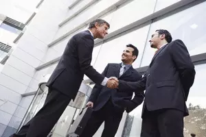 image of businessmen shaking hands